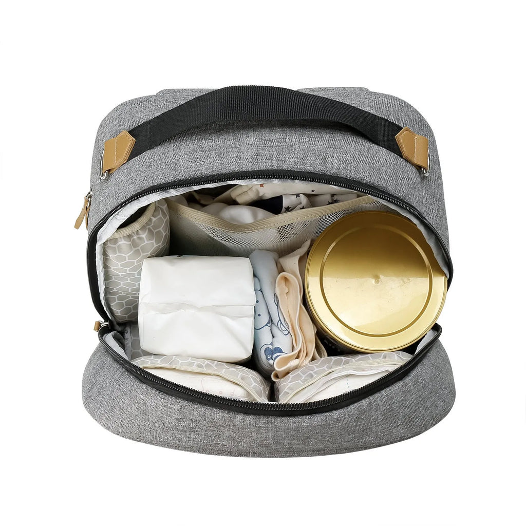 Grey insulated mother and child travel backpack with curved shoulder straps showing organisational compartments