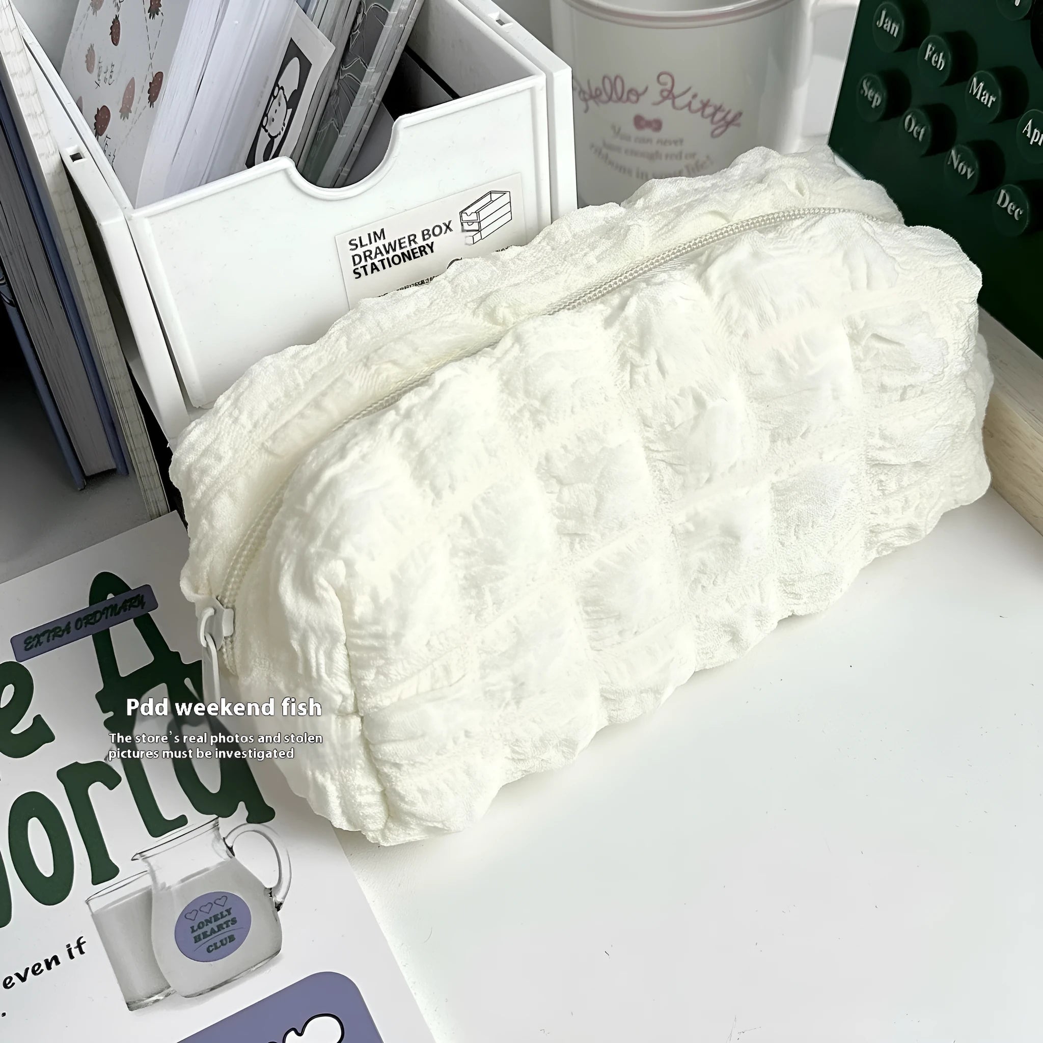 Cream puff style fabric pencil case in beige colour with zippered closure