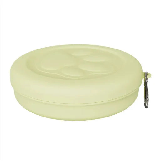 Foldable portable dog bowl with removable lid shown in a light green colour.