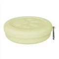 Foldable portable dog bowl with removable lid shown in a light green colour.