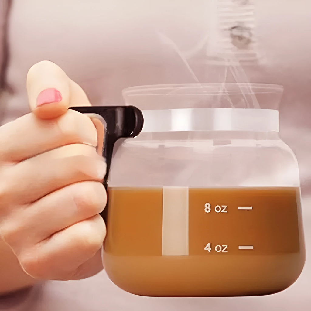 Transparent borosilicate glass coffee maker with silicone protective cover showing brewing capacity