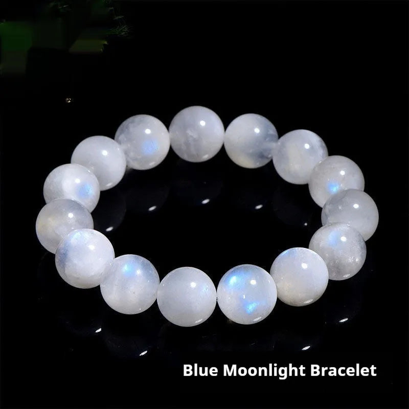 Natural blue moonlight round bead moonstone bracelet showing polished geometric beads on wrist