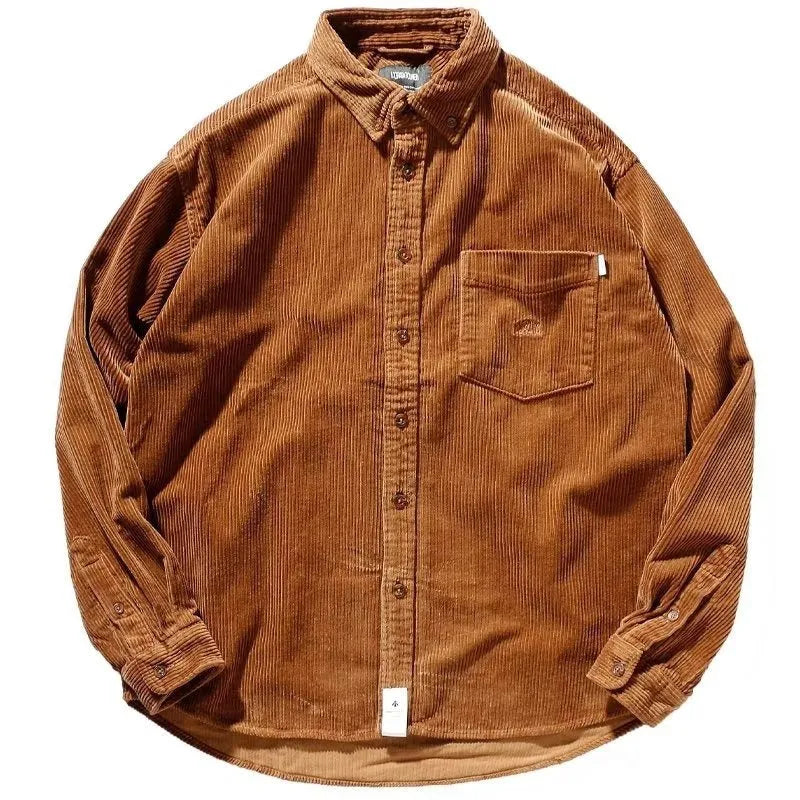 A man's loose-fit corduroy long sleeve casual shirt in caramel colour on a hanger.