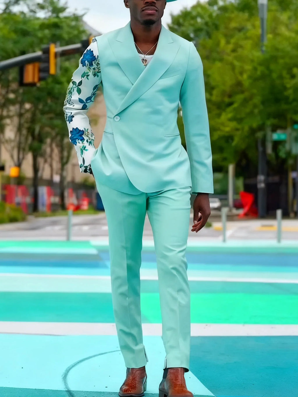 Mint green women's suit with double-breasted blazer and floral print sleeves, paired with ankle-length pants