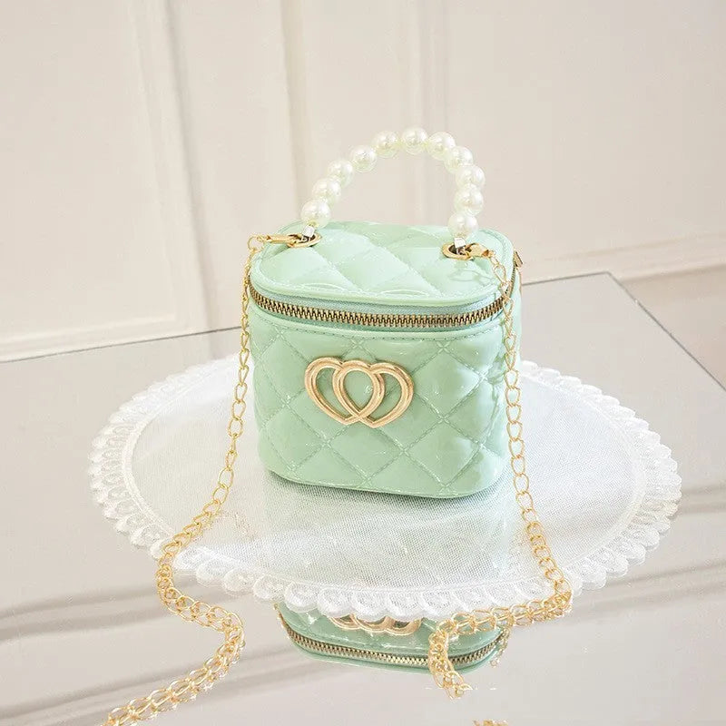 Women's PVC bucket shoulder bag with heart pattern in assorted colours