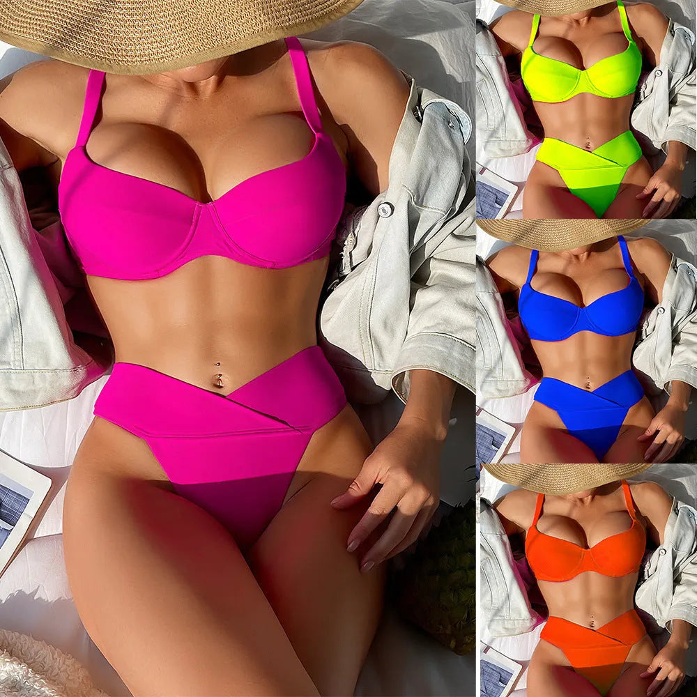 Women's solid colour nylon bikini swimsuit in fluorescent pink on a mannequin.