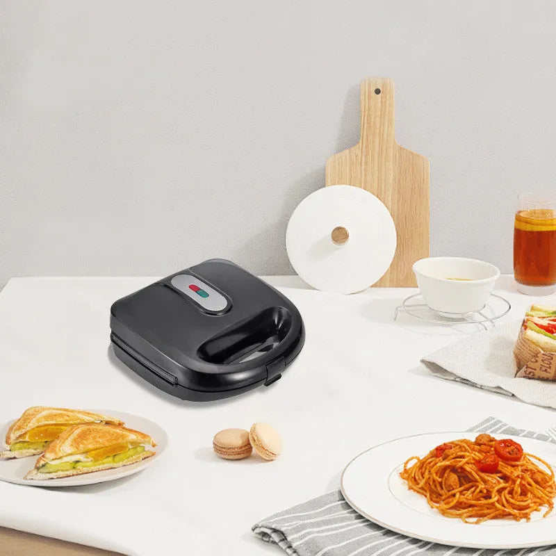 Black electric sandwich pan with double-sided heating, non-stick coating, and brushed stainless steel top cover