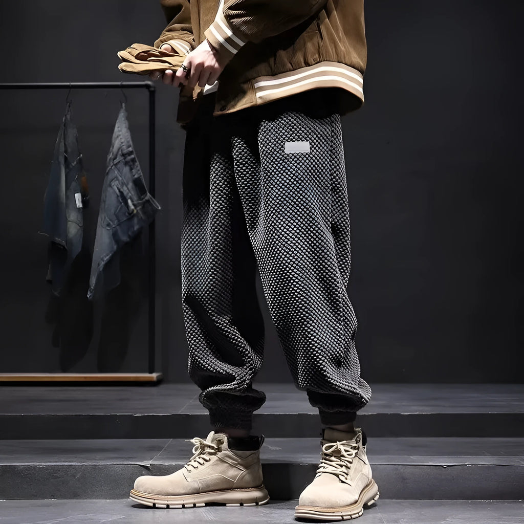 Men's grey ankle-tied sweatpants with a straight leg and non-ironing fabric.