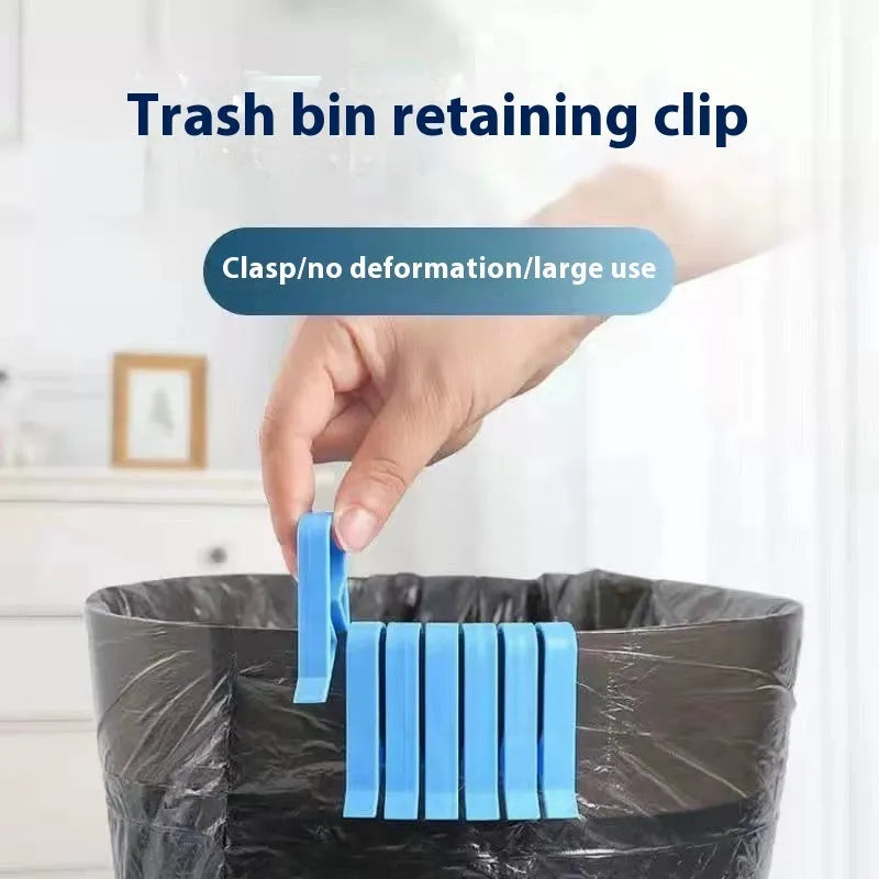 A white polypropylene plastic clip for holding bin bags onto the side of a rubbish bin.
