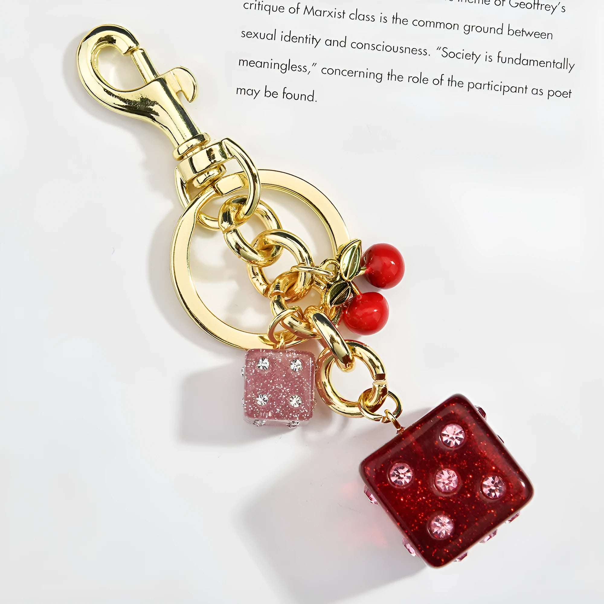 Square metal keychain pendant with cherry two-tone dice pattern and electroplated finish