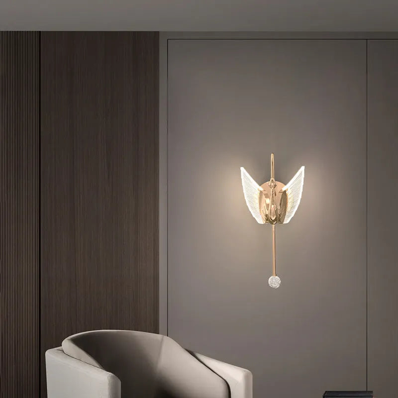 Gold swan-shaped LED wall lamp with acrylic shade and iron construction for bedroom lighting