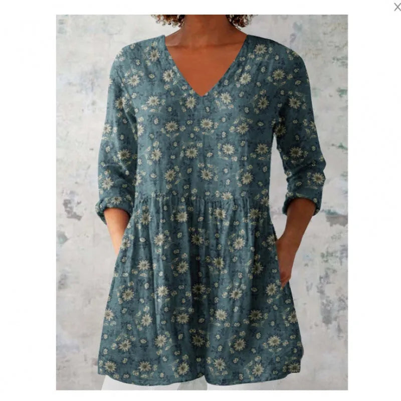 Women's printed loose wave dress with 3/4 sleeves and a wide waist on a hanger.