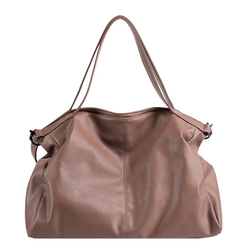 Large soft surface messenger bag in horizontal square shape with adjustable shoulder strap
