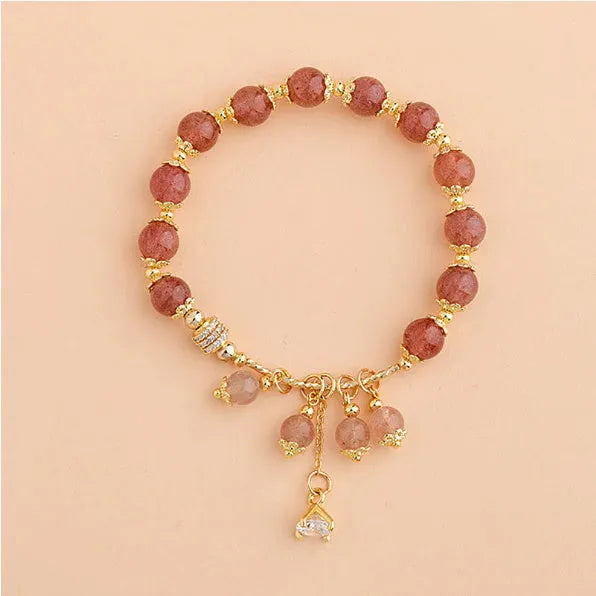 Pink strawberry quartz crystal bracelet with heart shape and pearl accents