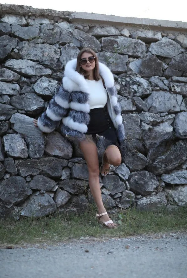 Women's loose fit hooded faux fur coat in street fashion style showing brown colour option