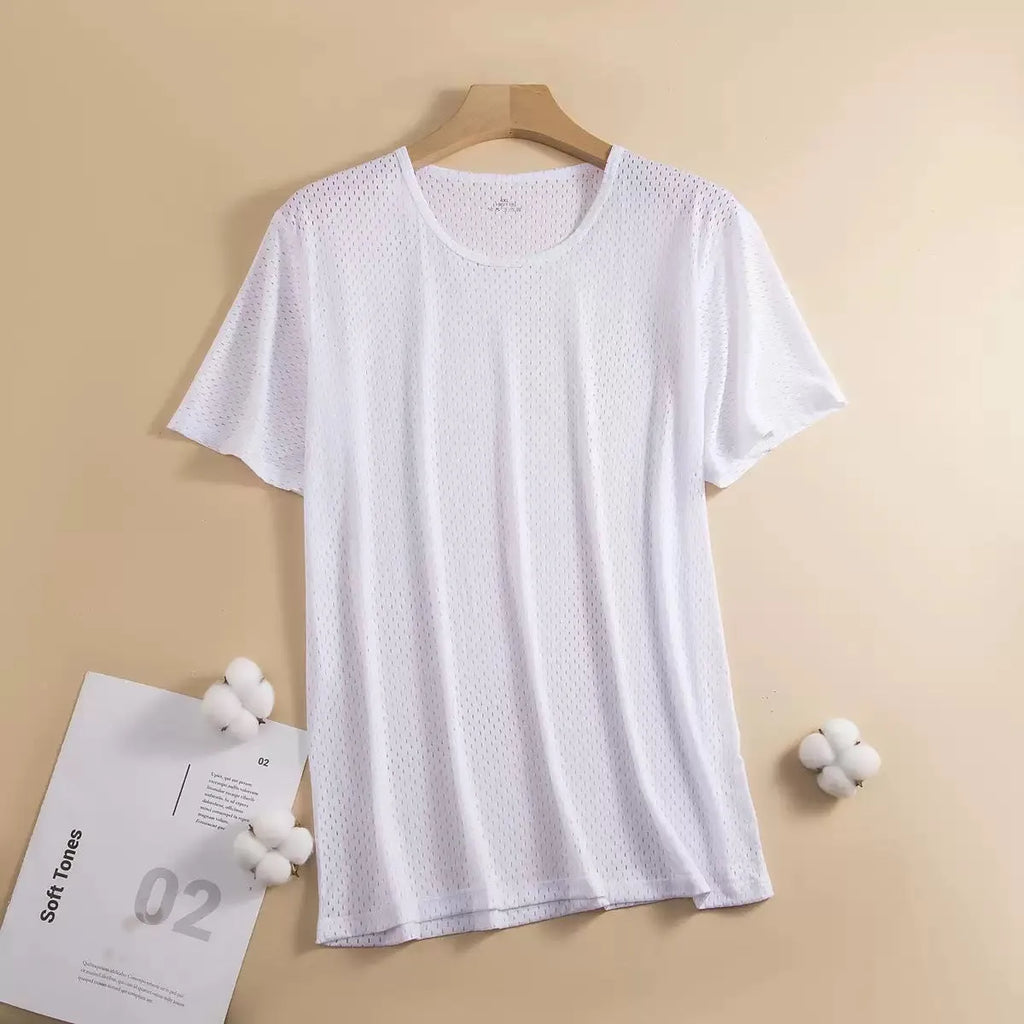 Man wearing a loose-fit grey ice silk short sleeve t-shirt on a summer day.