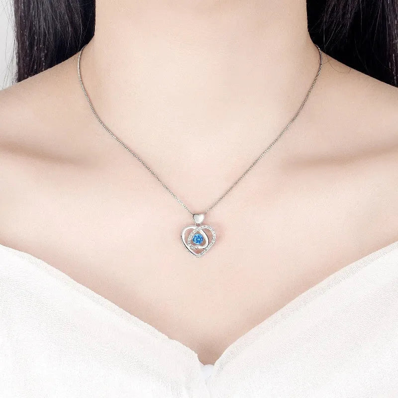 Blue diamond electroplated heart jewellery set with geometric pendant necklace and matching bracelet