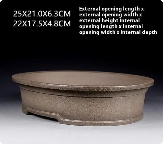 Handmade purple sand ceramic antique oval bonsai flower pot measuring 25x21x6.3cm