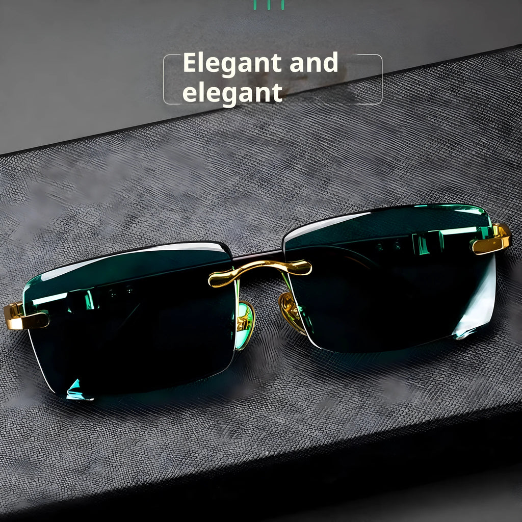 A pair of dark green frameless crystal sunglasses presented with a matching glasses case and a lens cloth.