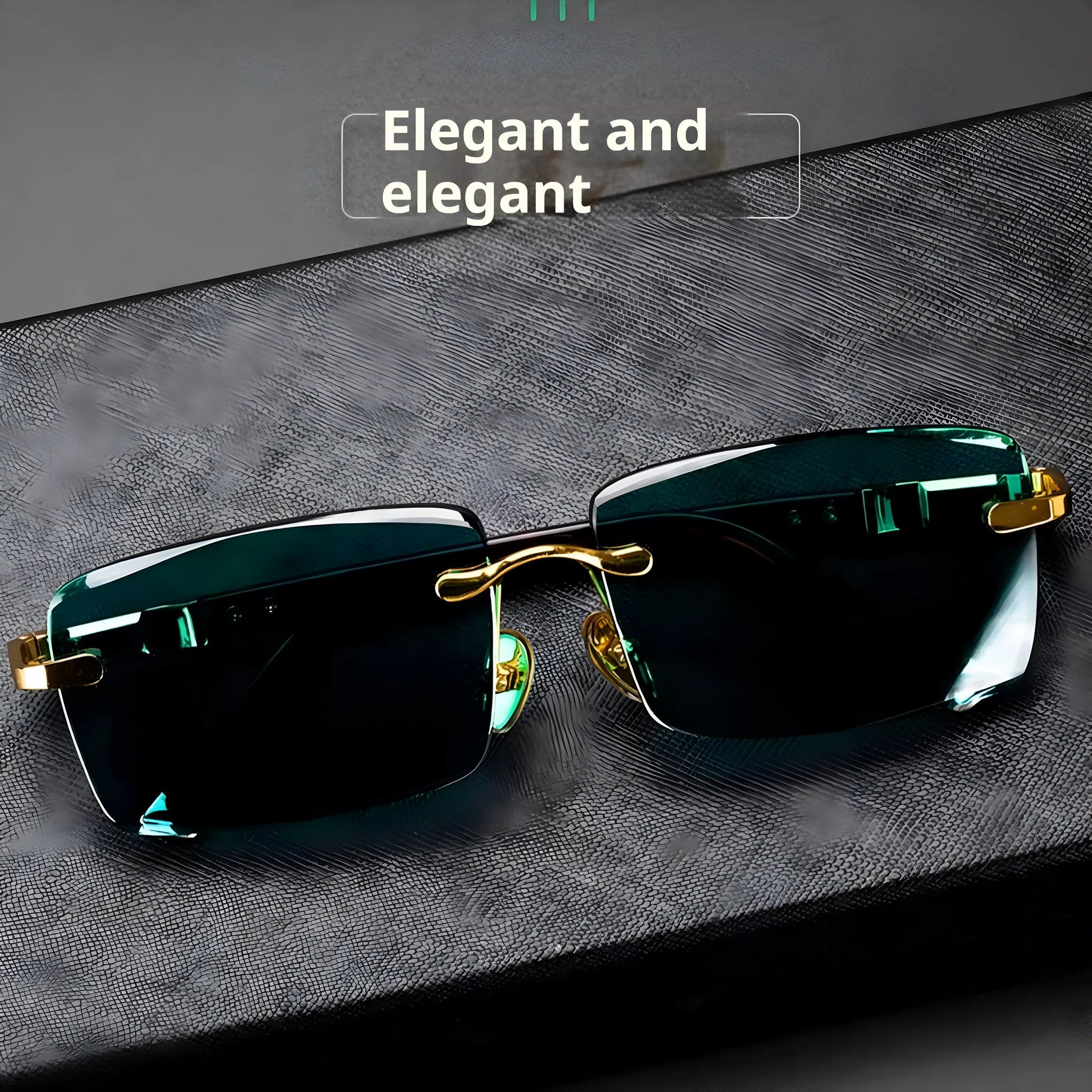 A pair of dark green frameless crystal sunglasses presented with a matching glasses case and a lens cloth.