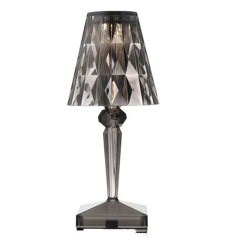 Rose gold portable touch night light on a surface, showing its acrylic body and modern design.