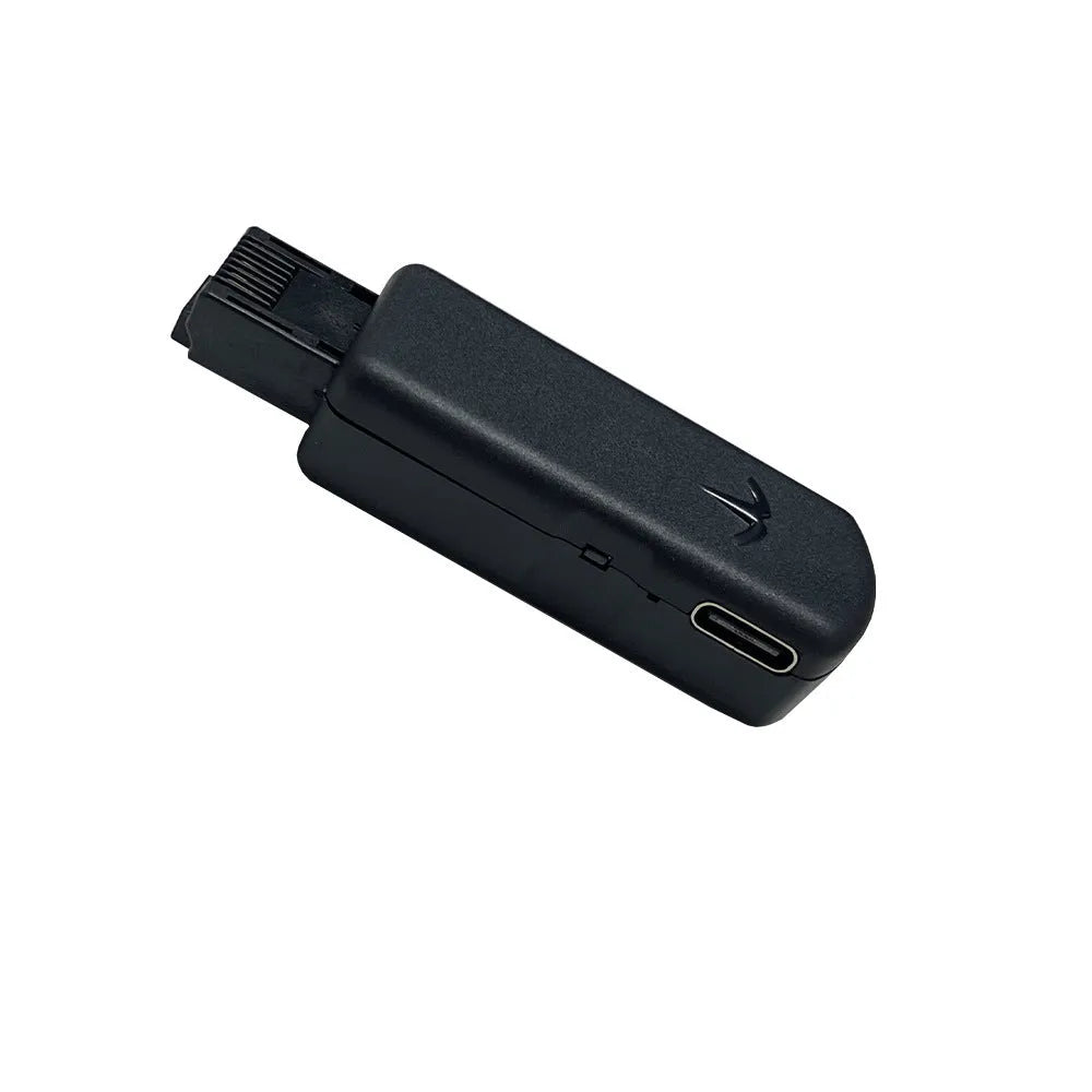 Black JB Tool USB adapter for PS5 console with Ethernet port, shown with USB cable.