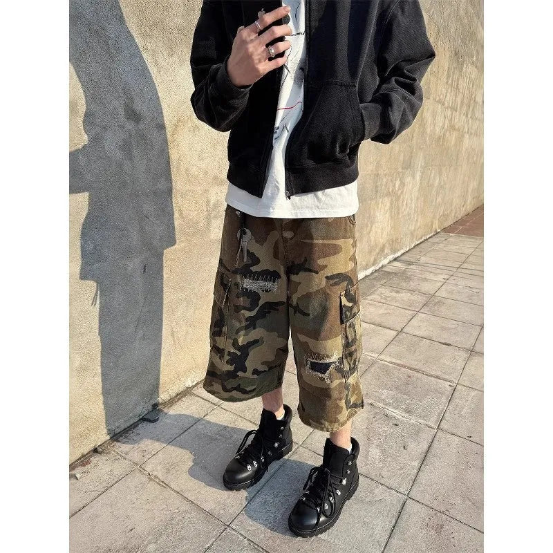 Men's camouflage cropped jeans with patchwork and ripped details in loose straight cut