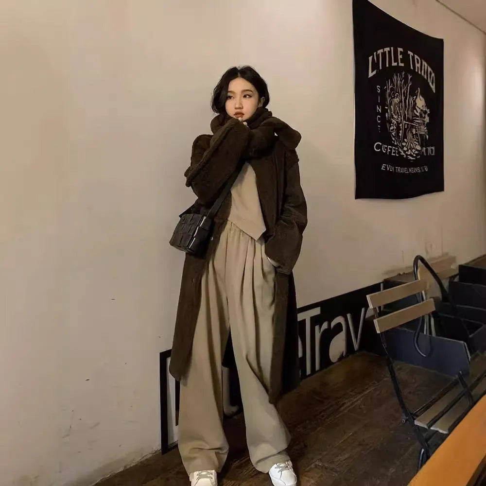 Women's khaki casual sports suit set with long sleeve top and matching trousers on a hanger.