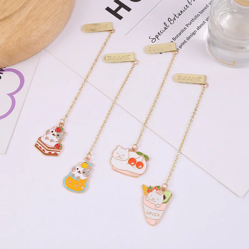 Jane Lime metal cat bookmark with food-themed designs including Strawberry Cake Cat and Cherry Sleeping Cat