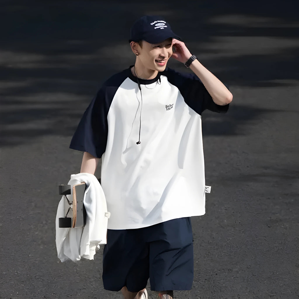 Men's loose blue raglan sleeve T-shirt made from thin polyester blend fabric.