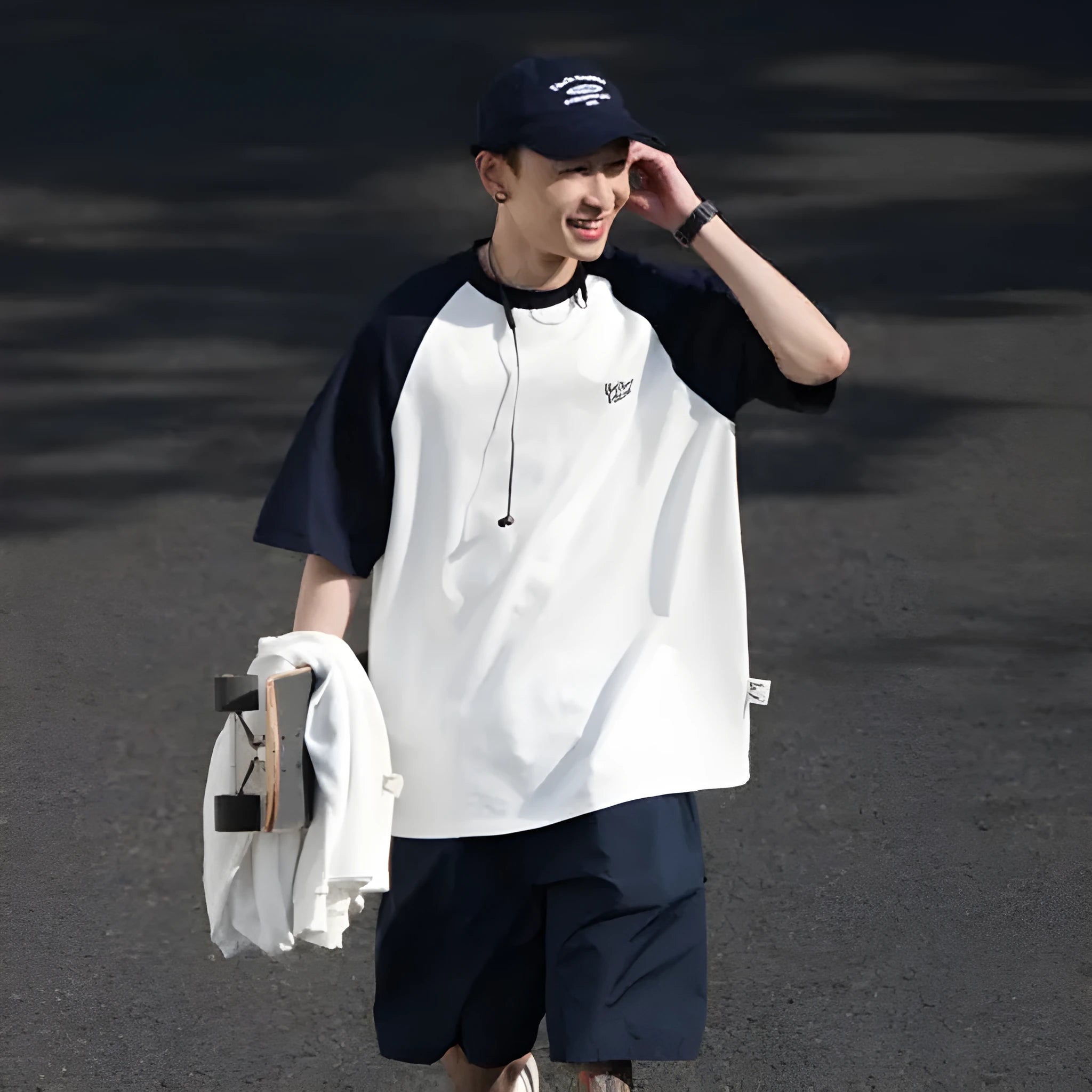 Men's loose blue raglan sleeve T-shirt made from thin polyester blend fabric.
