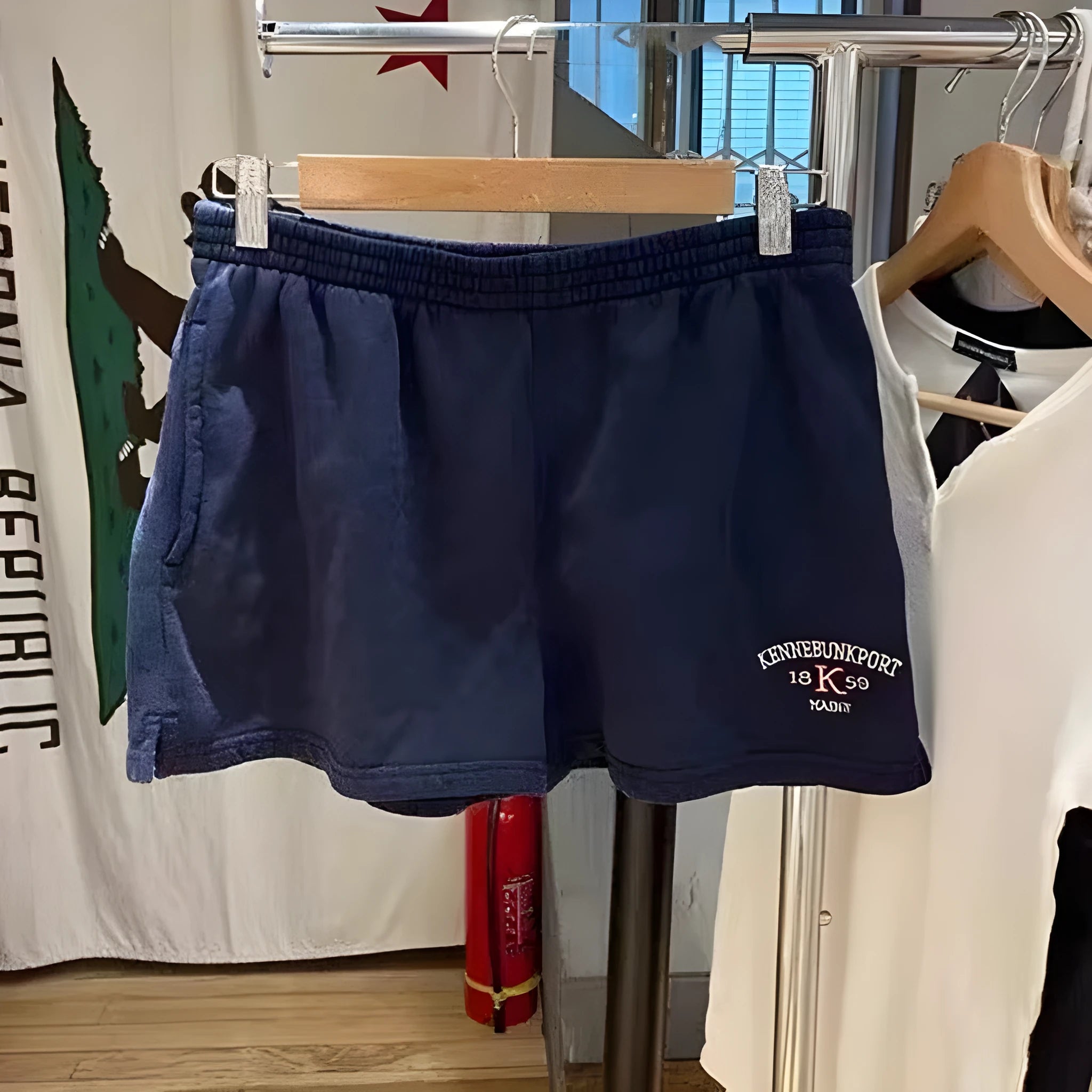 Dark blue cotton sports shorts with white flag embroidery and navy contrast detailing