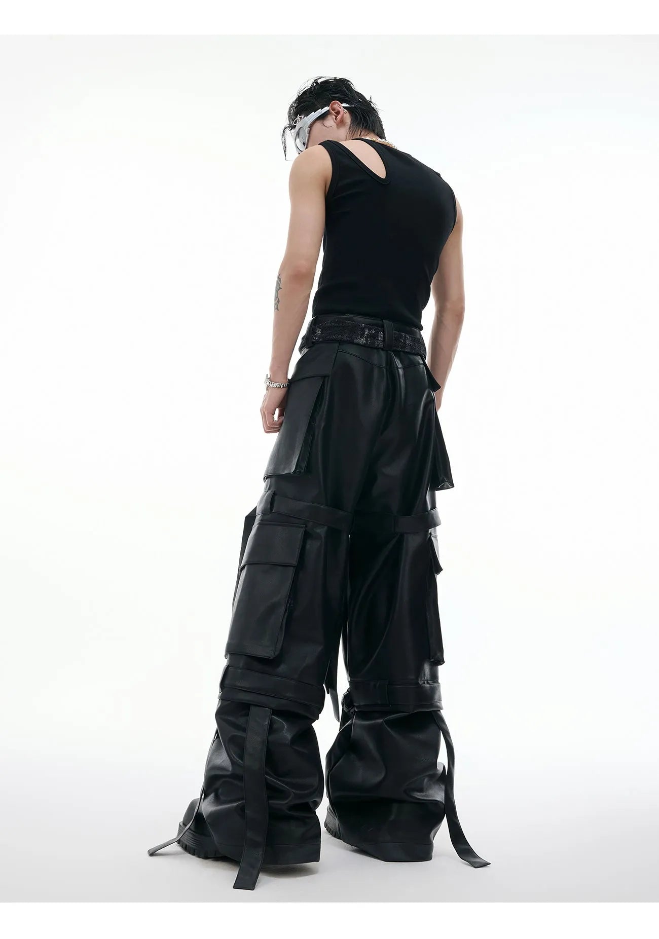 Black retro loose leather pants with quilted panels and multiple pockets
