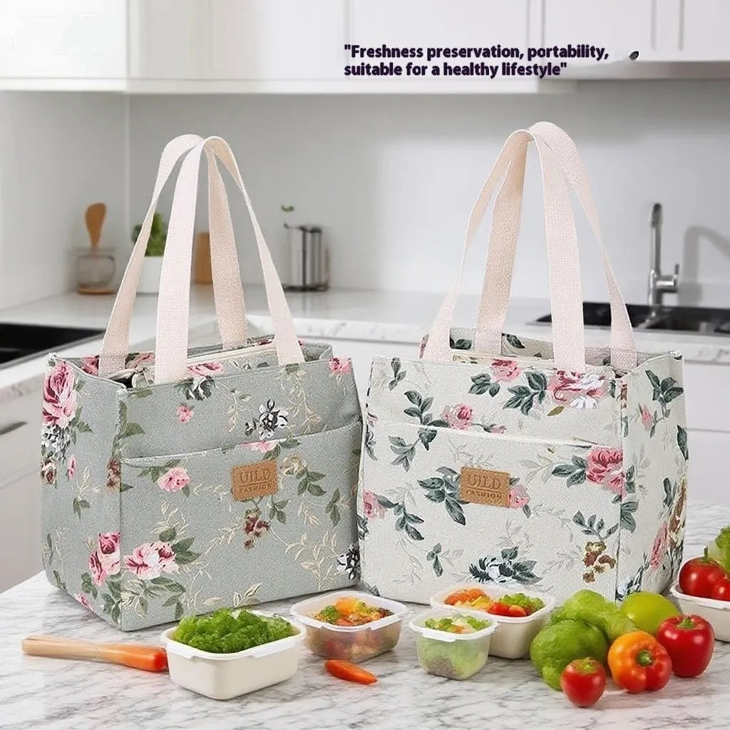 Women's printed canvas square handbag in a floral design, showing large capacity and structured shape.