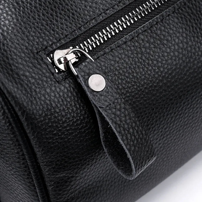 Black genuine leather one-shoulder crossbody bag showing front view