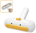 White duck-shaped pet hair remover tool with handle and bristles for removing pet fur
