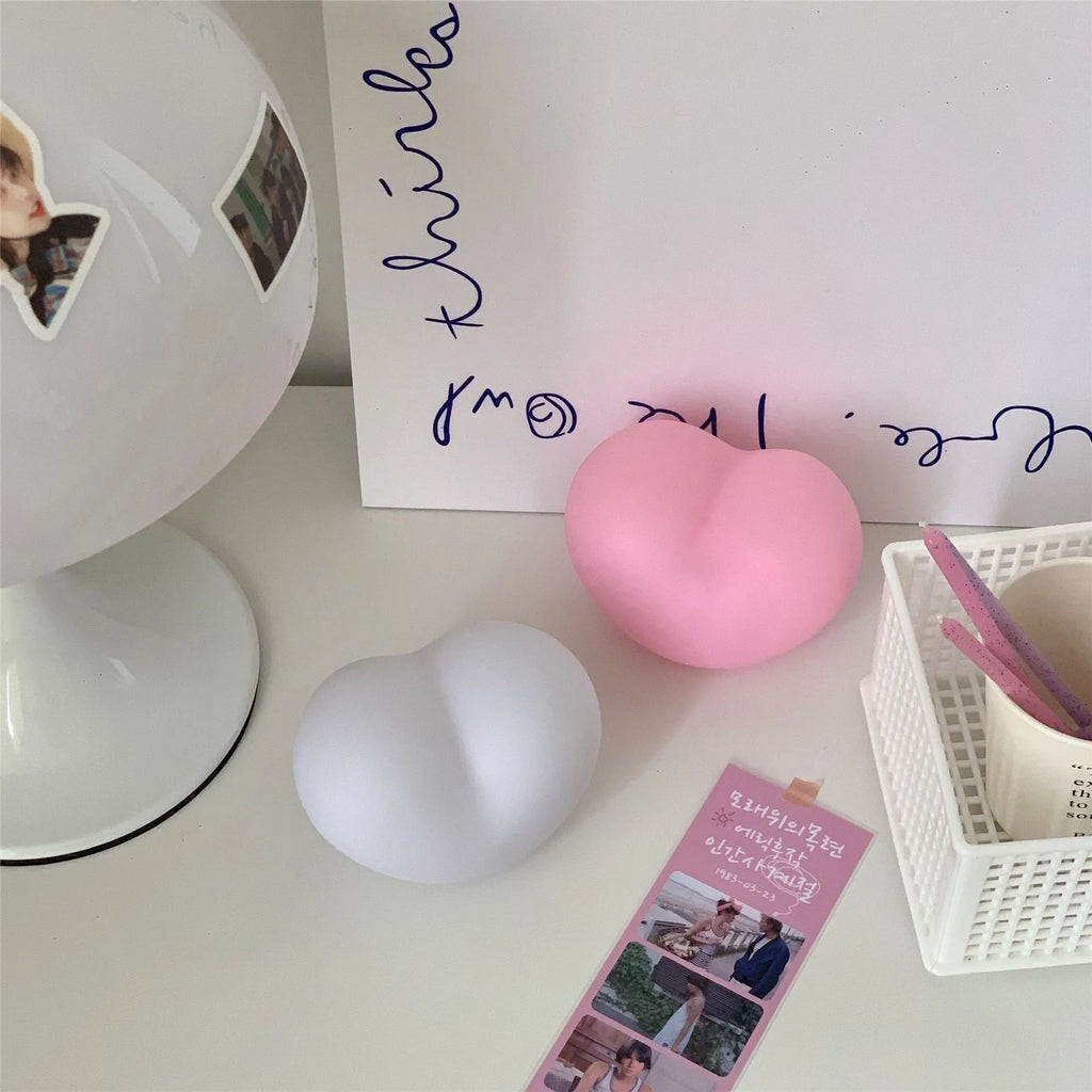 White and pink vinyl atmosphere lamps showing small and large size options with battery power