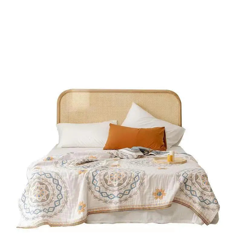 Cotton geometric pattern towel blanket shown in modern simplicity style, folded to show texture.