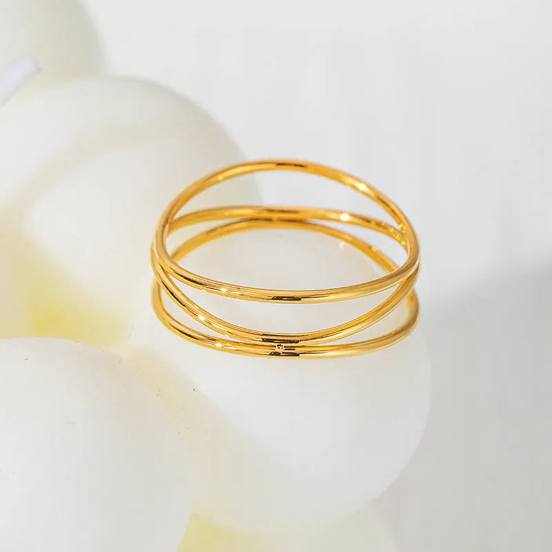 Three-layer geometric coil gold ring in electroplated titanium steel women's jewellery