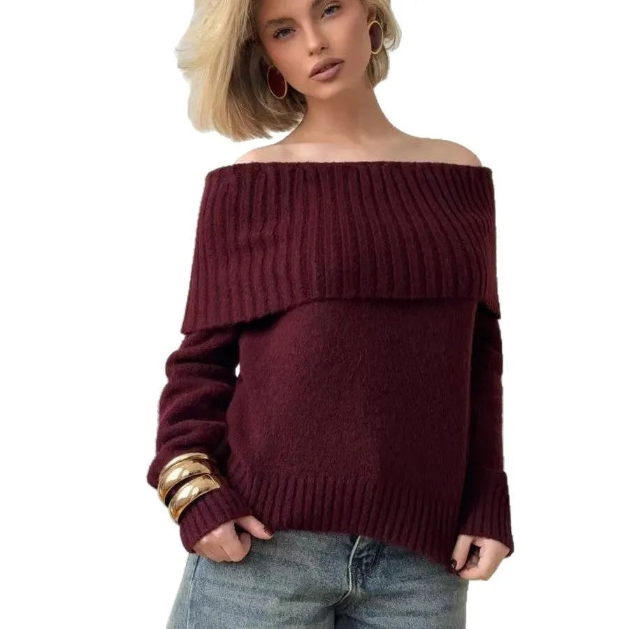Grey off-the-shoulder sweater with a strapless neckline and a raised 3D pattern across the front.
