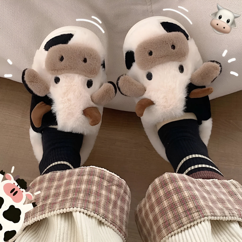 White cow-themed plush slippers for women with a non-slip textured sole.
