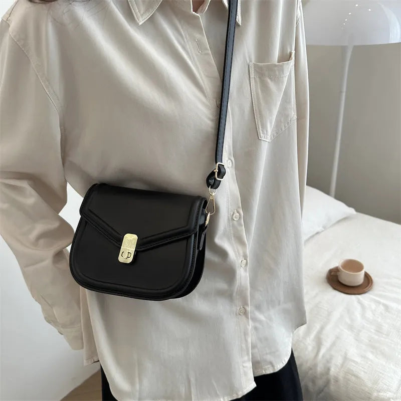 Soft PU leather messenger bag with clamshell opening in a horizontal square shape.