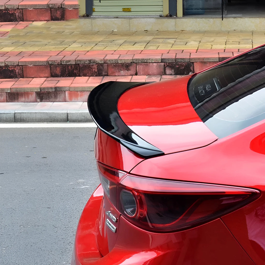 Mazda 3 Exela modified tail trim in bright black finish - large fixed wind-surrounded blade spoiler