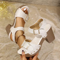 Plus size high heel sandals with a buckle strap and rivet detail on a rubber sole, shown in beige colour.