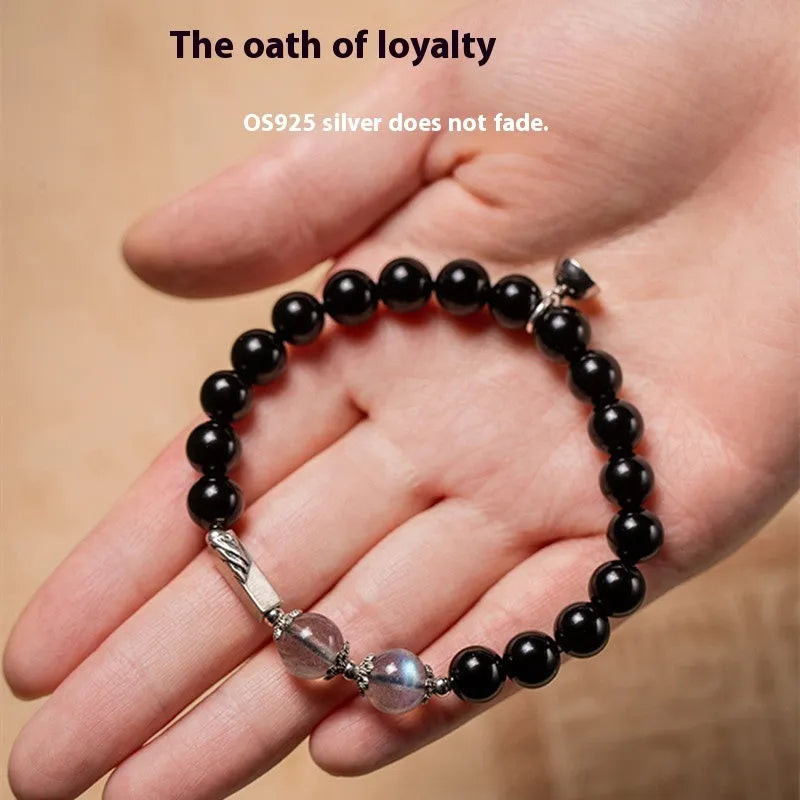 Black obsidian Buddha beads bracelets for couples, showing 8mm and 10mm bead sizes on a traditional cord.