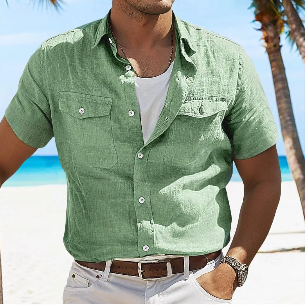 Man wearing a loose grey cotton cardigan-style shirt with a polo collar and long sleeves.