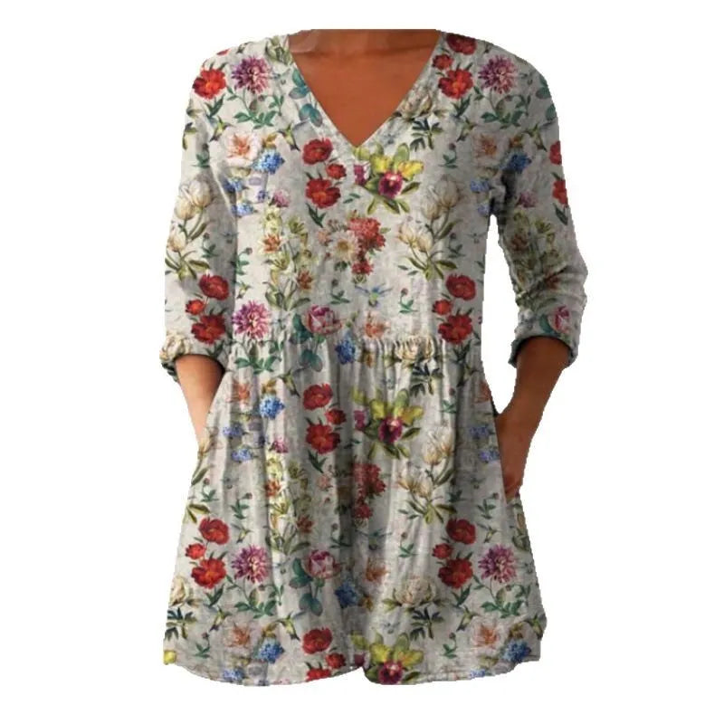 Women's printed loose wave dress with 3/4 sleeves and a wide waist on a hanger.