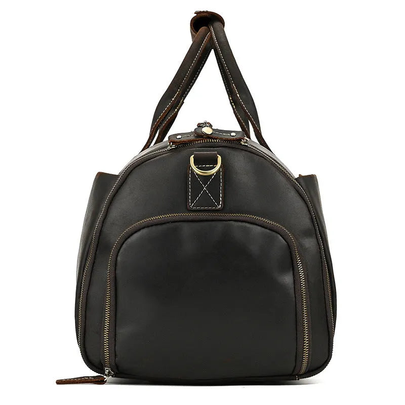 Vintage 22 inch brown leather duffle bag made from top layer cowhide, folding design with zipper closure on plain background