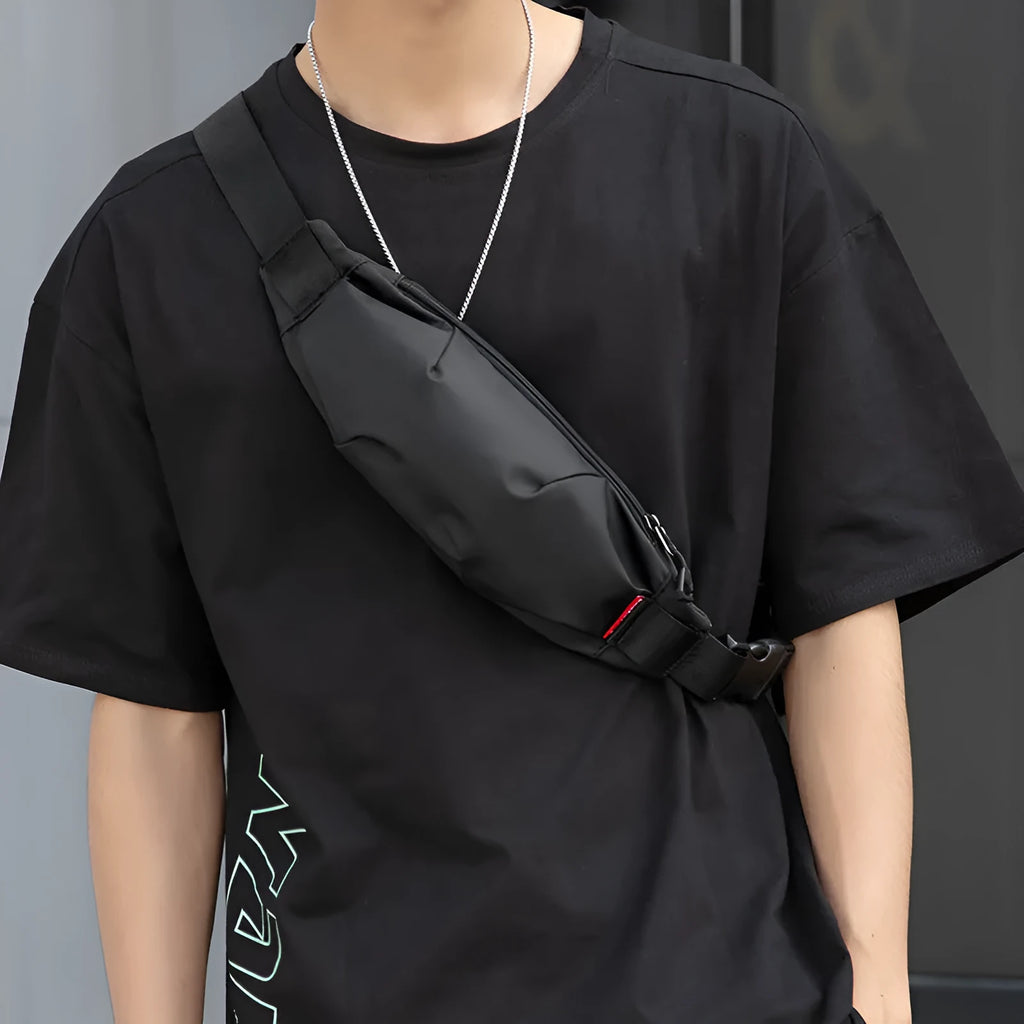 Black Oxford cloth men's waist pack with crossbody strap, showing internal phone and ID pockets.