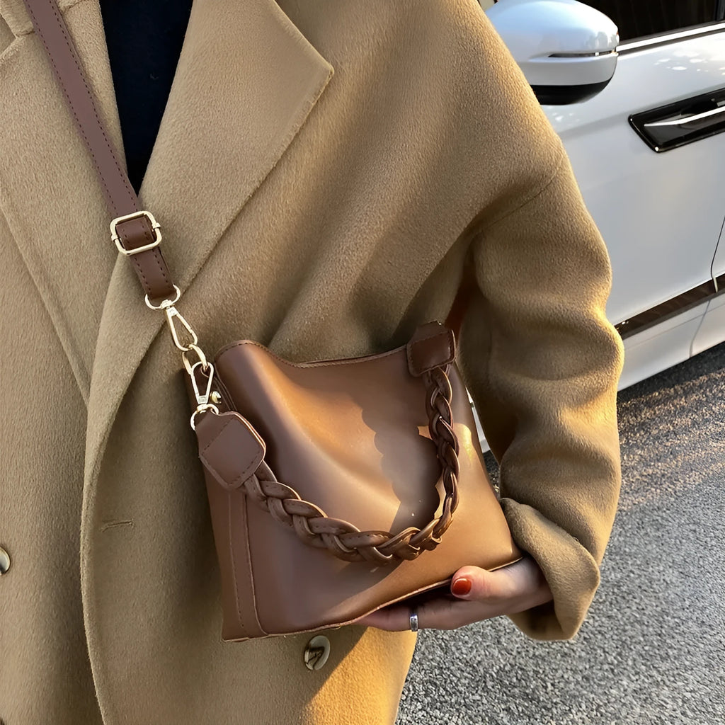 Retro-inspired woven PU crossbody bucket bag in khaki colour showing androgynous design details